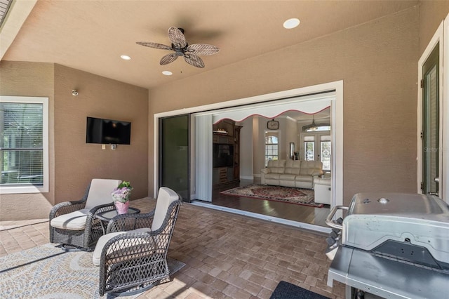 716 Woodbridge Ct, Ormond Beach, FL 32174 - view of patio / terrace with ceiling fan and an outdoor living space