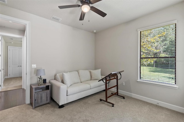 716 Woodbridge Ct, Ormond Beach, FL 32174 - carpeted living room featuring a ceiling fan and baseboards