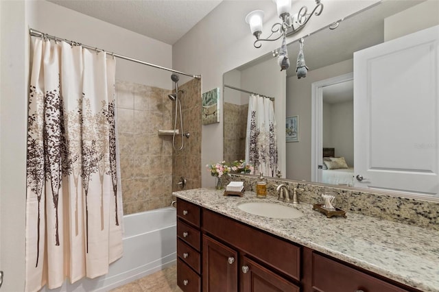 716 Woodbridge Ct, Ormond Beach, FL 32174 - bathroom featuring shower / tub combo with curtain, vanity, tile patterned flooring, and a textured ceiling