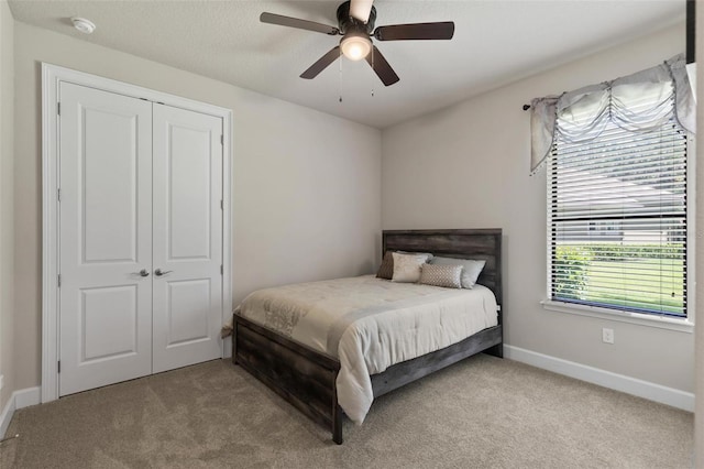 716 Woodbridge Ct, Ormond Beach, FL 32174 - carpeted bedroom with a closet, baseboards, and a ceiling fan