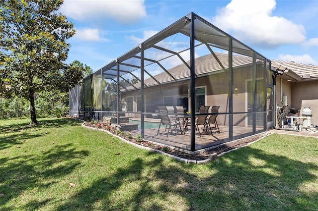 716 Woodbridge Ct, Ormond Beach, FL 32174 - rear view of house featuring a yard, a patio, a tile roof, an outdoor pool, and stucco siding