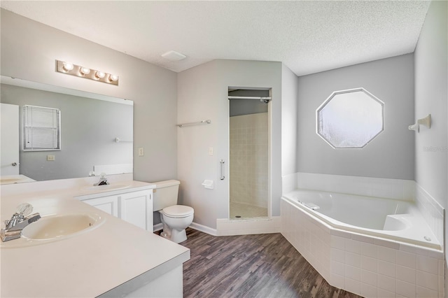 2212 Cortez Ct, Middleburg, FL 32068 - full bathroom featuring toilet, a bath, wood finished floors, double vanity, and a shower stall