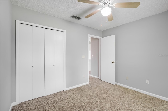 2212 Cortez Ct, Middleburg, FL 32068 - unfurnished bedroom featuring light colored carpet, a closet, a textured ceiling, baseboards, and ceiling fan