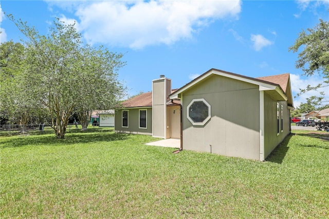 2212 Cortez Ct, Middleburg, FL 32068 - back of house with a chimney and a shingled roof