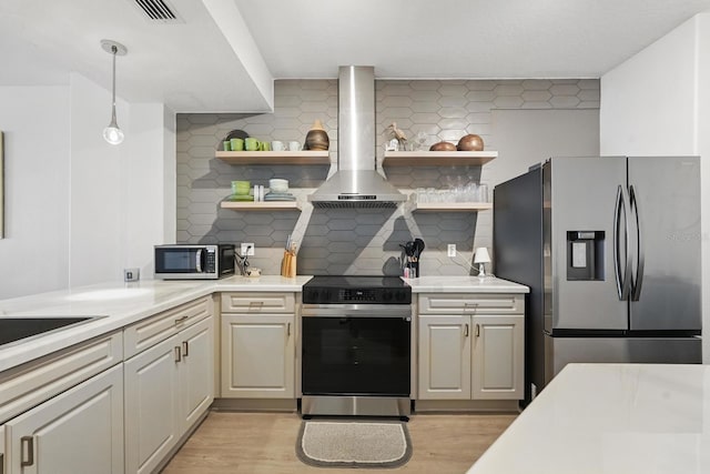 80 Surfview Dr Unit 511, Palm Coast, FL 32137 - kitchen with stainless steel appliances, open shelves, wall chimney exhaust hood, and light wood-style flooring
