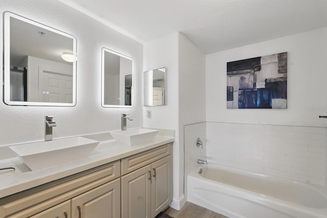80 Surfview Dr Unit 511, Palm Coast, FL 32137 - full bath with a bath, double vanity, and wood finished floors