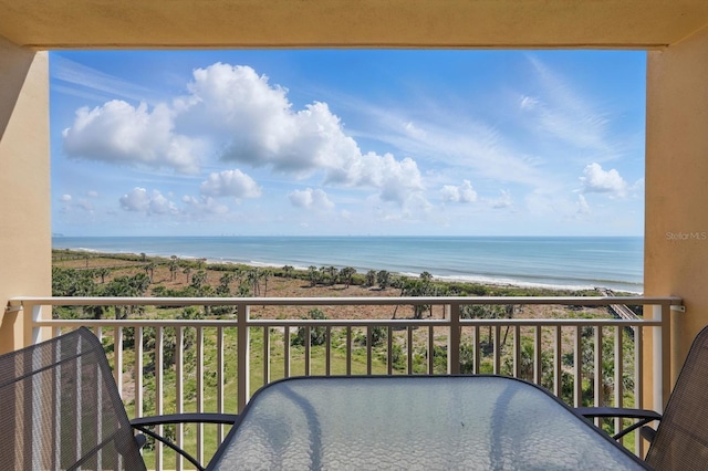 80 Surfview Dr Unit 511, Palm Coast, FL 32137 - balcony featuring view of water and beach and outdoor dining area