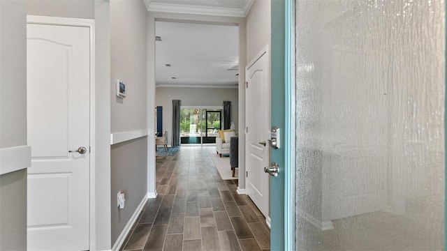 151 Greenwood Dr, Palm Coast, FL 32137 - hallway with crown molding, dark wood-style floors, and baseboards