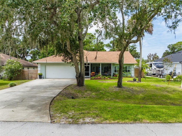 135 Lambert Ave, Flagler Beach, FL 32136 - single story home with concrete driveway, a garage, and a sunroom