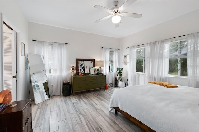 135 Lambert Ave, Flagler Beach, FL 32136 - bedroom featuring light wood-style flooring and a ceiling fan