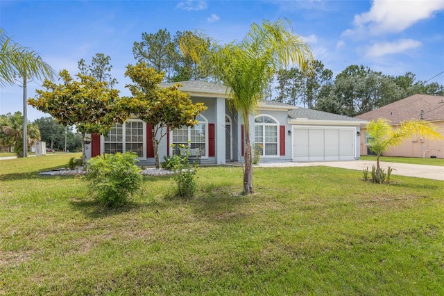 view of front of home with an attached garage, concrete driveway, a front yard, and stucco siding