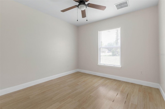 unfurnished room featuring light wood-style flooring, baseboards, and ceiling fan