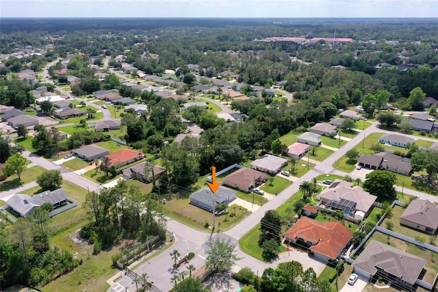 aerial view of property's location with nearby suburban area