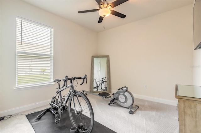2840 Monaghan Dr, Ormond Beach, FL 32174 - exercise area featuring a ceiling fan, baseboards, and carpet floors