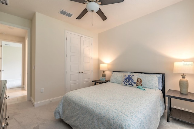 2840 Monaghan Dr, Ormond Beach, FL 32174 - bedroom featuring a closet, light colored carpet, baseboards, and ceiling fan