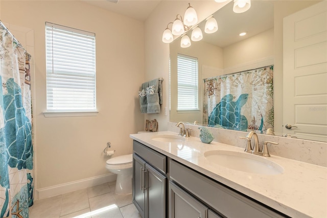 2840 Monaghan Dr, Ormond Beach, FL 32174 - bathroom featuring tile patterned flooring, toilet, baseboards, double vanity, and a shower with curtain