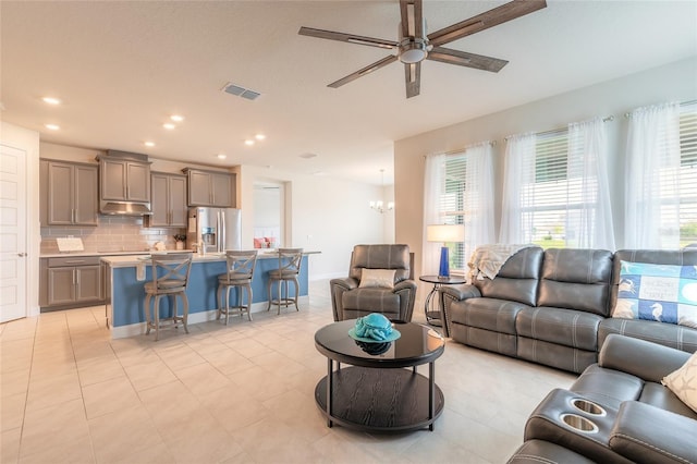 2840 Monaghan Dr, Ormond Beach, FL 32174 - living area with a ceiling fan, healthy amount of natural light, light tile patterned floors, and recessed lighting