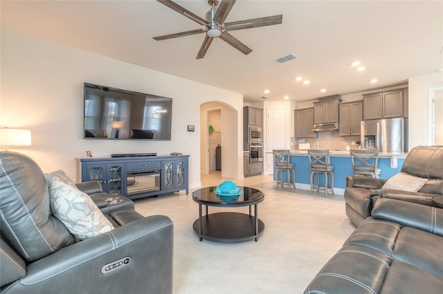 2840 Monaghan Dr, Ormond Beach, FL 32174 - living area with arched walkways, a ceiling fan, and recessed lighting