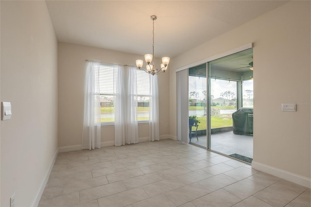 2840 Monaghan Dr, Ormond Beach, FL 32174 - spare room with a chandelier, baseboards, and light tile patterned flooring