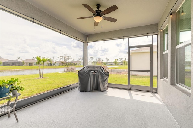 2840 Monaghan Dr, Ormond Beach, FL 32174 - sunroom with a ceiling fan, a water view, and a residential view