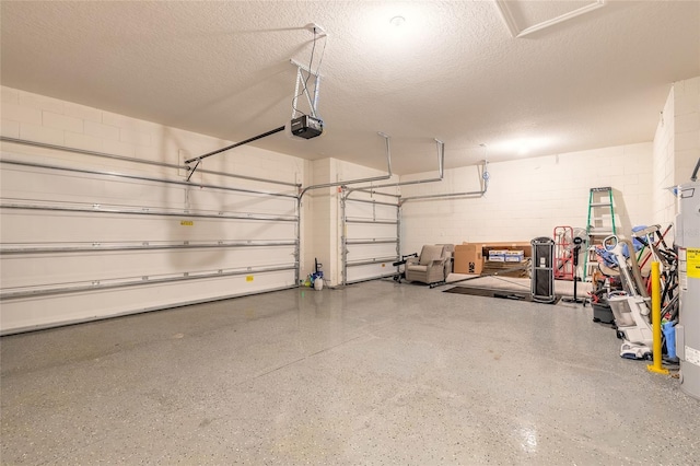2840 Monaghan Dr, Ormond Beach, FL 32174 - garage featuring a garage door opener and concrete block wall