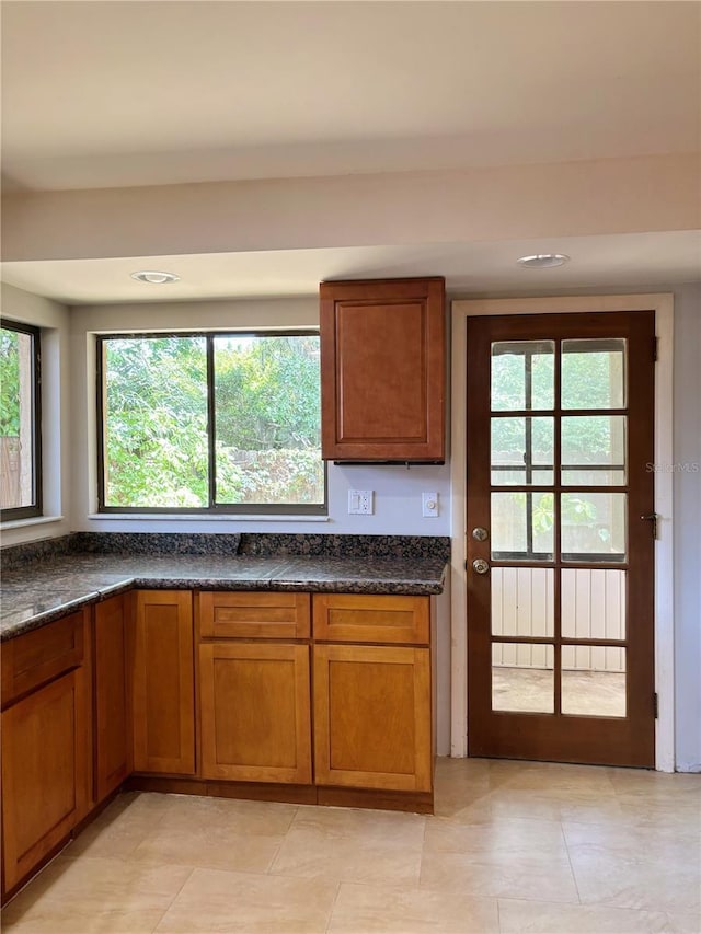 20 Blakeshire Pl, Palm Coast, FL 32137 - kitchen with brown cabinets, light tile patterned flooring, and recessed lighting