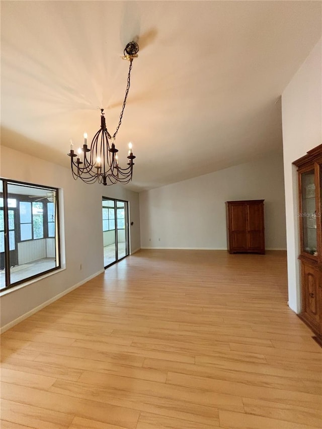 20 Blakeshire Pl, Palm Coast, FL 32137 - unfurnished room with a chandelier, light wood-style floors, and baseboards