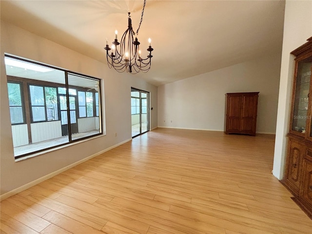 20 Blakeshire Pl, Palm Coast, FL 32137 - unfurnished room with a chandelier, light wood-style flooring, lofted ceiling, and baseboards