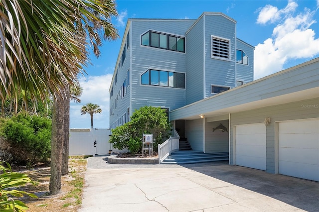 2900 Coastal Hwy Unit 1, Saint Augustine, FL 32084 - view of building exterior featuring concrete driveway and fence