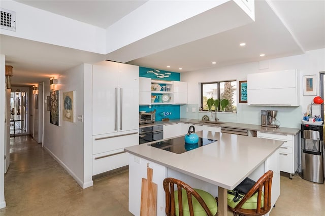 2900 Coastal Hwy Unit 1, Saint Augustine, FL 32084 - kitchen featuring black appliances, a sink, finished concrete flooring, recessed lighting, and open shelves
