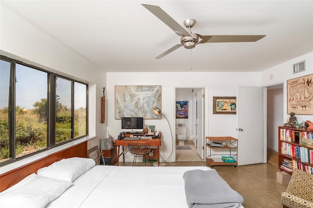 2900 Coastal Hwy Unit 1, Saint Augustine, FL 32084 - bedroom with ensuite bath, concrete floors, and a ceiling fan