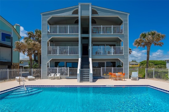 2900 Coastal Hwy Unit 1, Saint Augustine, FL 32084 - community pool with fence, a patio area, and stairs