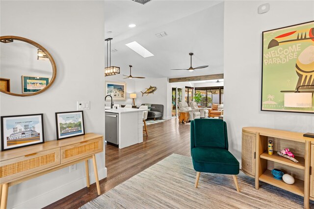 54 Fordham Ln, Palm Coast, FL 32137 - living room featuring a ceiling fan, wood finished floors, a skylight, and vaulted ceiling