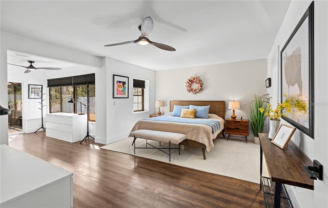 54 Fordham Ln, Palm Coast, FL 32137 - bedroom featuring wood finished floors, access to exterior, a ceiling fan, and baseboards