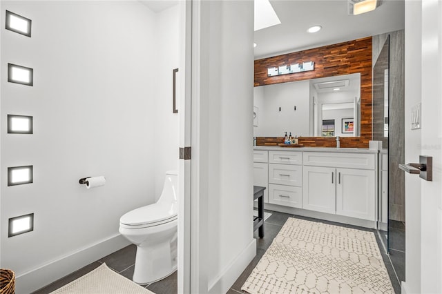 54 Fordham Ln, Palm Coast, FL 32137 - full bathroom featuring baseboards, vanity, toilet, tile patterned floors, and recessed lighting