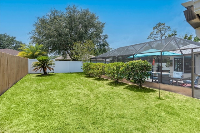 54 Fordham Ln, Palm Coast, FL 32137 - view of yard with glass enclosure and a patio