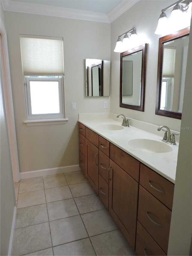 543 Sandy Oaks Blvd, Ormond Beach, FL 32174 - bathroom with ornamental molding, baseboards, tile patterned flooring, and double vanity