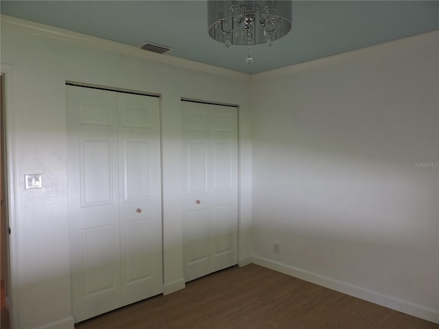 543 Sandy Oaks Blvd, Ormond Beach, FL 32174 - unfurnished bedroom with wood finished floors and baseboards