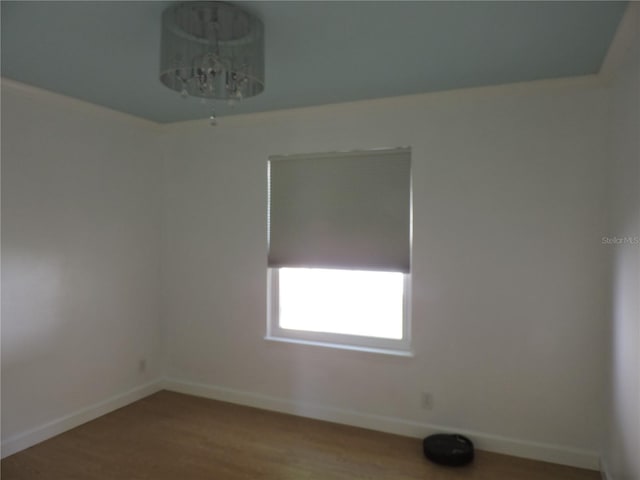 543 Sandy Oaks Blvd, Ormond Beach, FL 32174 - unfurnished room featuring baseboards and wood finished floors