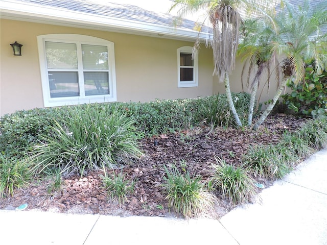 543 Sandy Oaks Blvd, Ormond Beach, FL 32174 - view of side of property featuring stucco siding