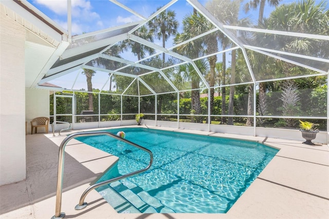 11 White Oak Ln, Palm Coast, FL 32164 - outdoor pool with a patio area and glass enclosure
