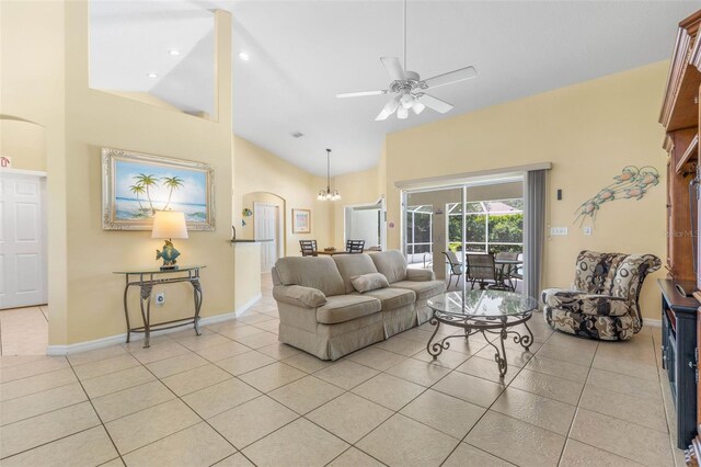 11 White Oak Ln, Palm Coast, FL 32164 - living room featuring light tile patterned flooring, ceiling fan, high vaulted ceiling, baseboards, and arched walkways