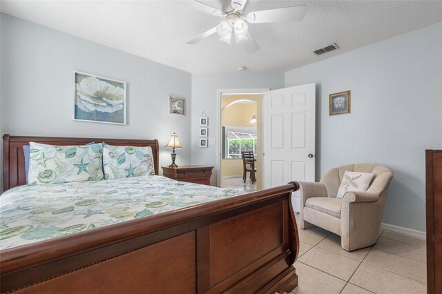 11 White Oak Ln, Palm Coast, FL 32164 - bedroom featuring light tile patterned floors, baseboards, and a ceiling fan