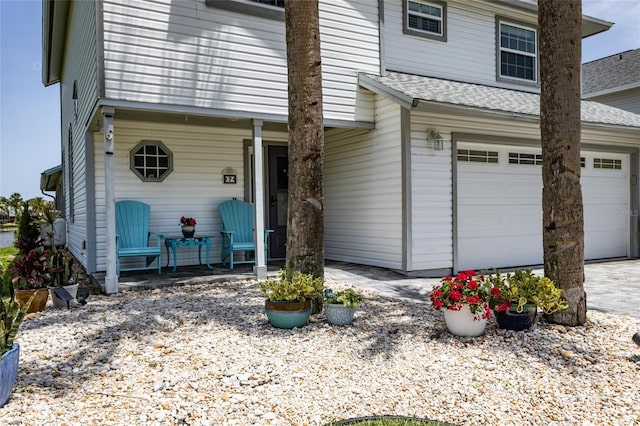 7 Bristol Dr, Palm Coast, FL 32137 - view of front of home featuring a shingled roof and driveway