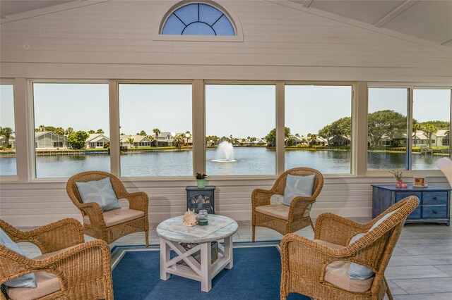 7 Bristol Dr, Palm Coast, FL 32137 - sunroom / solarium with lofted ceiling, a water view, wood walls, and a residential view