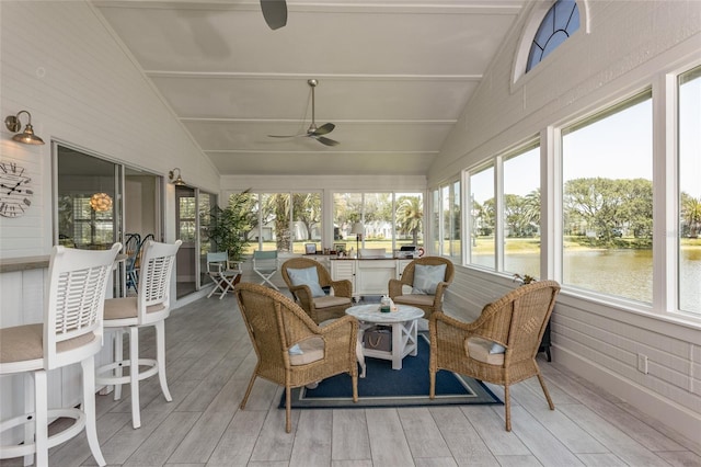 7 Bristol Dr, Palm Coast, FL 32137 - sunroom featuring ceiling fan, lofted ceiling, wood finished floors, and a deck with water view