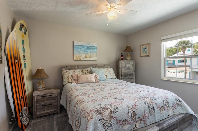 7 Bristol Dr, Palm Coast, FL 32137 - bedroom with dark carpet, a textured ceiling, and a ceiling fan