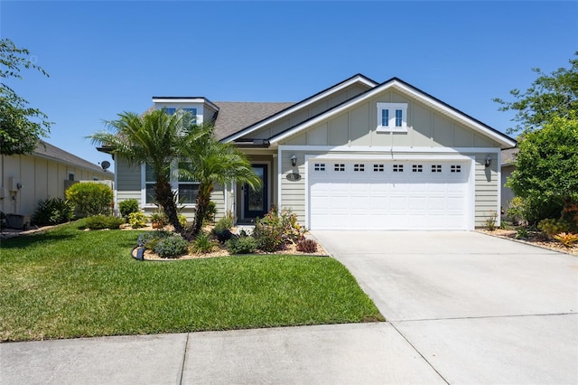 115 N Coopers Hawk Way, Palm Coast, FL 32164 - view of front facade with board and batten siding, a garage, a front lawn, and driveway