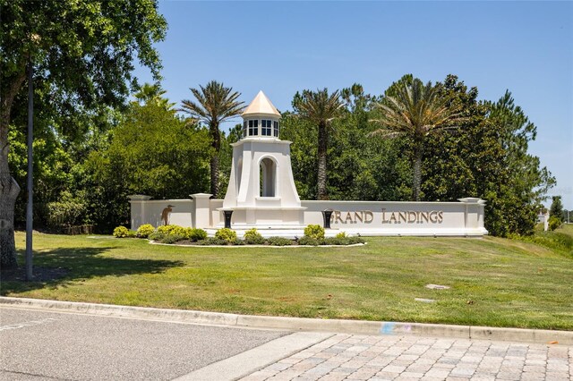 115 N Coopers Hawk Way, Palm Coast, FL 32164 - view of community featuring a lawn