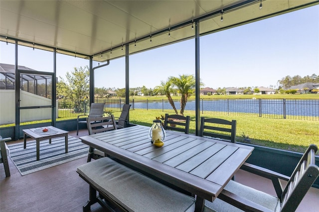115 N Coopers Hawk Way, Palm Coast, FL 32164 - sunroom / solarium featuring a water view, outdoor dining space, and a residential view